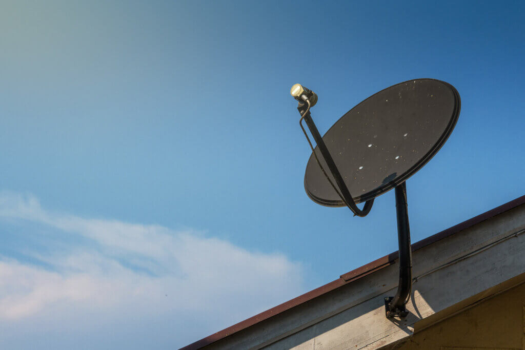 a satellite dish installed on a home