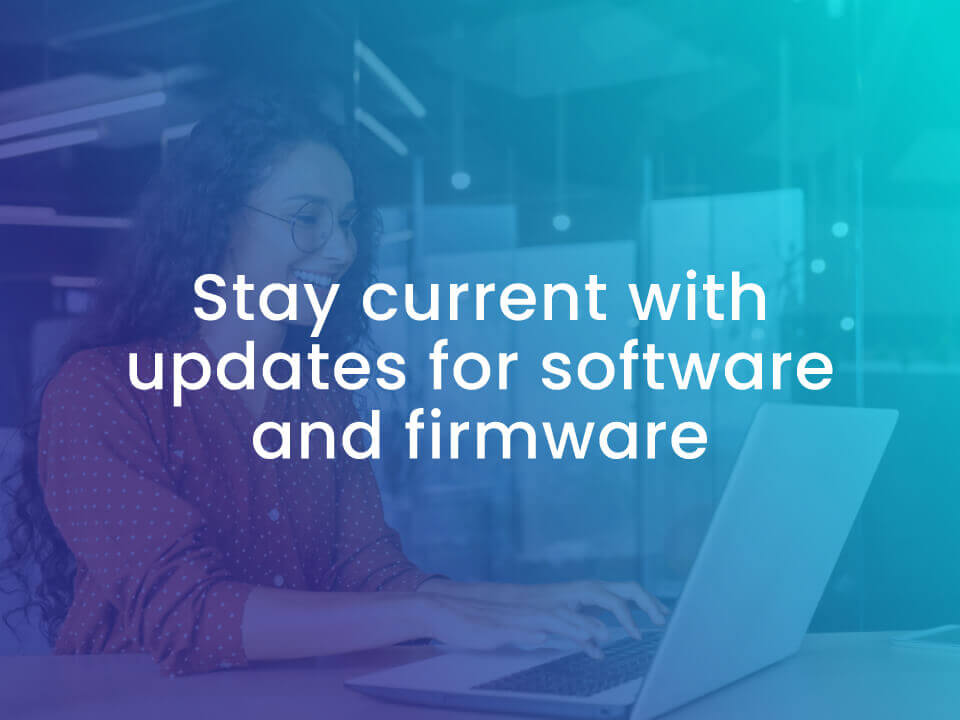 image of woman using laptop to update her firmware