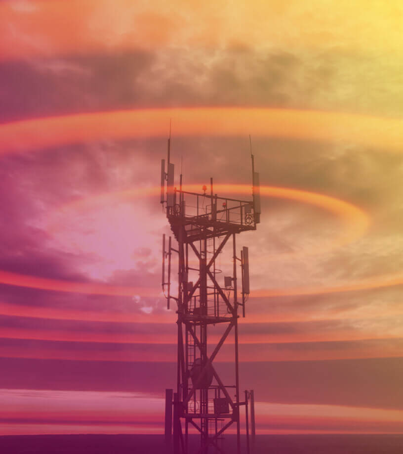 Wireless tower against a beautiful dawn sky trasmitting Wi-Fi signals