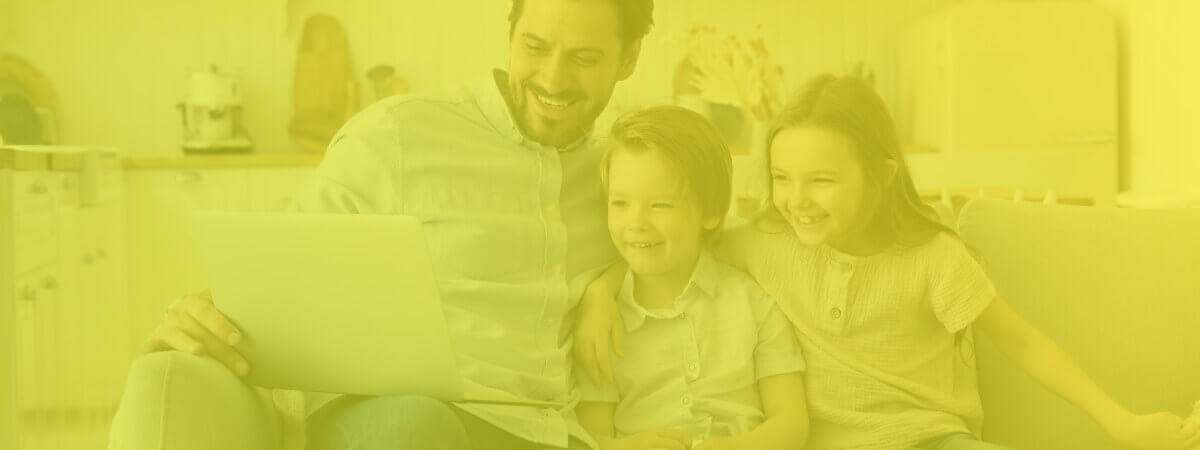 family looks at laptop after finding the optimal router channels with image of smiling father and children