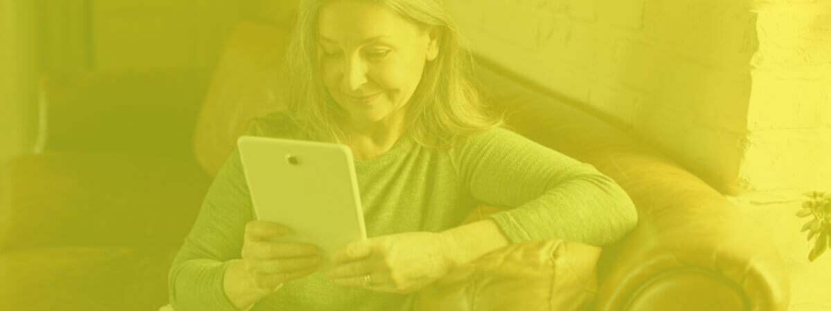 Woman finding optimal router channels to use her home internet in a peaceful corner