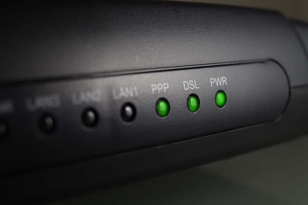 Black modem with green status lights