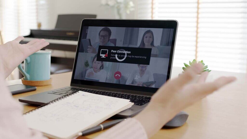 a laptop on a zoom call with a poor connection prompt