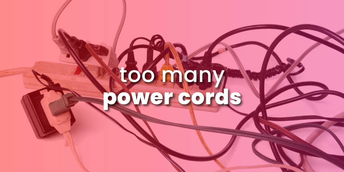 too many cables cause electromagnetic interference with image of tangled cords and power strip