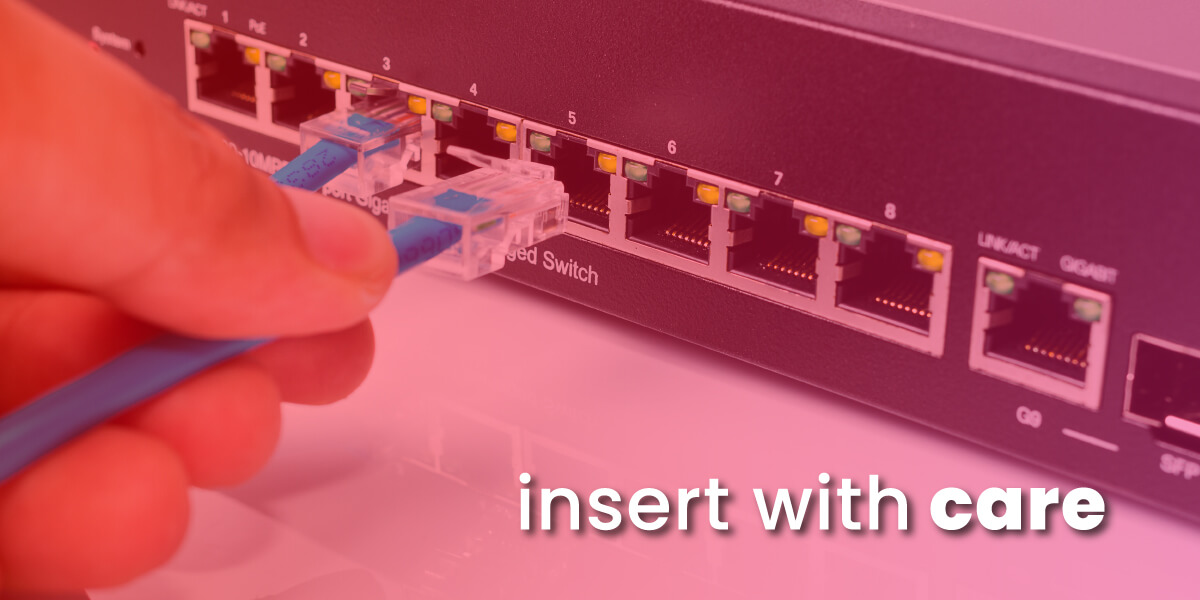 insert into ethernet port with care showing image of hand inserting cable into router