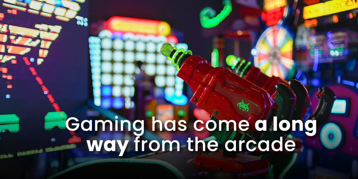 Online gaming in much more advanced than arcade gaming with image of neon arcade games and Space Invaders