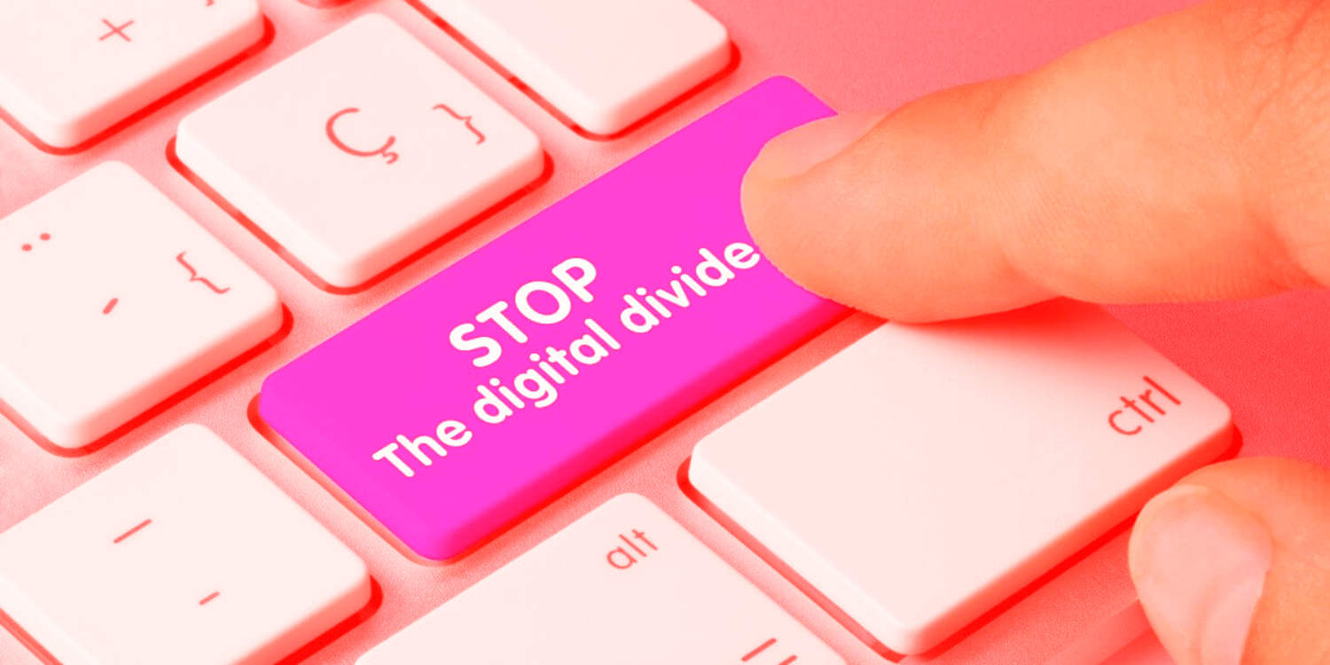 finger pressing keyboard button saying STOP the Digital Divide