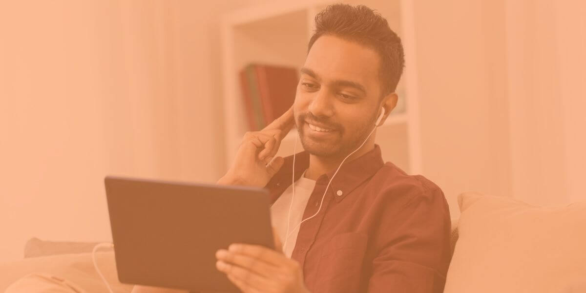 Man enjoys his tablet with prepaid internet plan