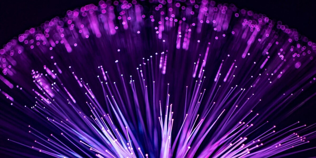 image of cluster of fiber-optic lights in purple