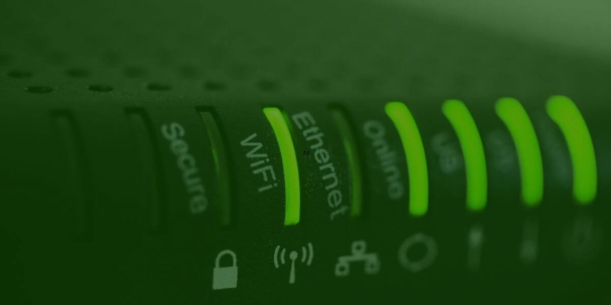 Glowing green router with lights for ethernet, internet, wi-fi