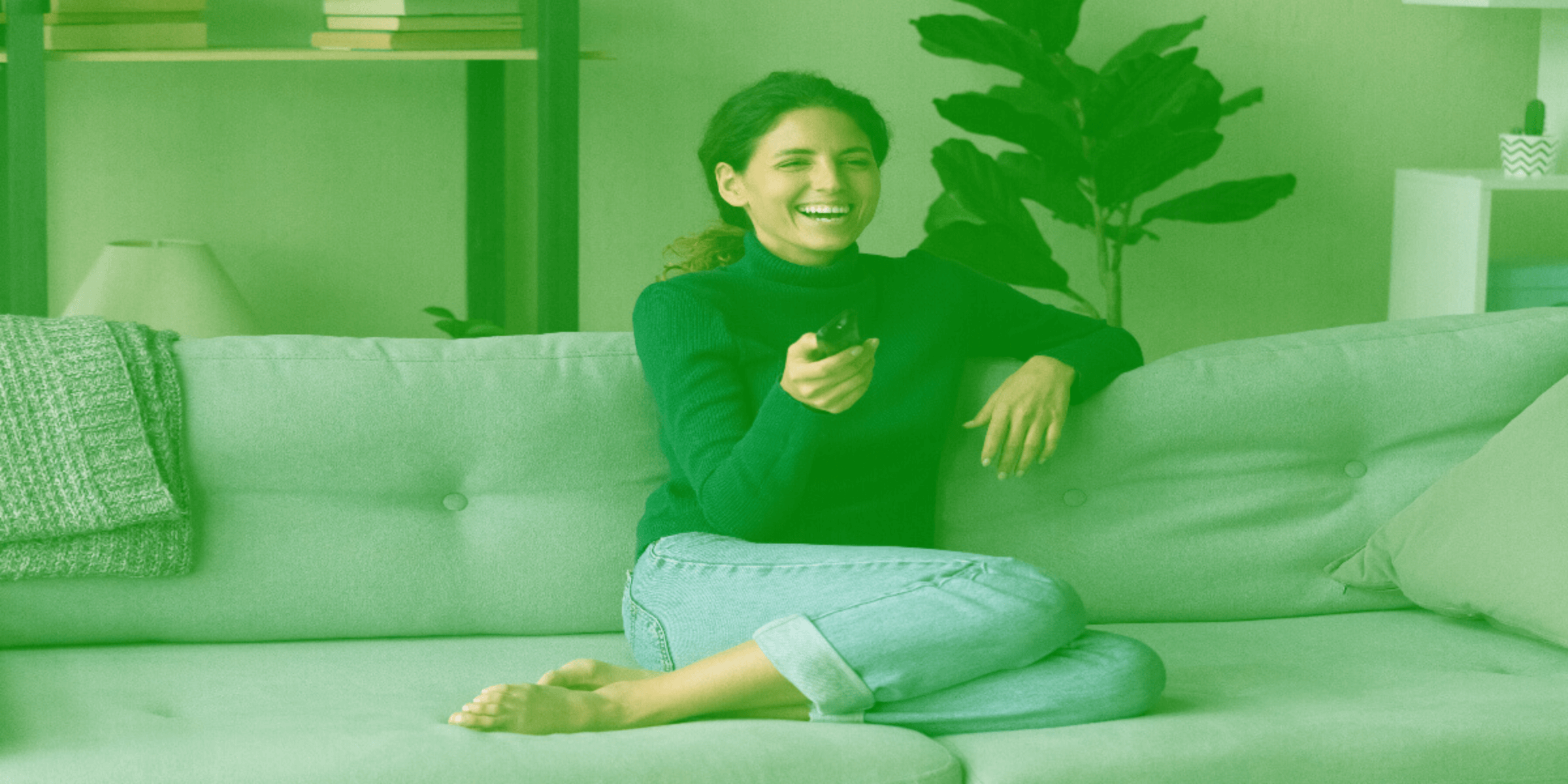Woman smiling while watching TV
