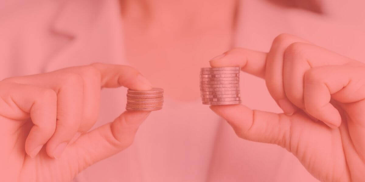 a person holds differing amounts of coins in each hand