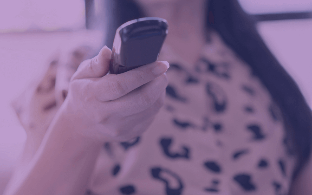 Woman with TV control on hand