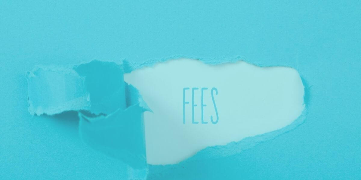 torn strip of paper reveals the word fees beneath to show hidden fees