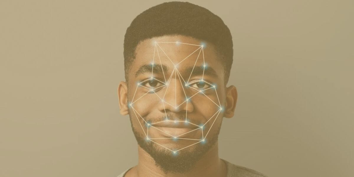 Man with digital pinpoints and lines showing facial recognition software