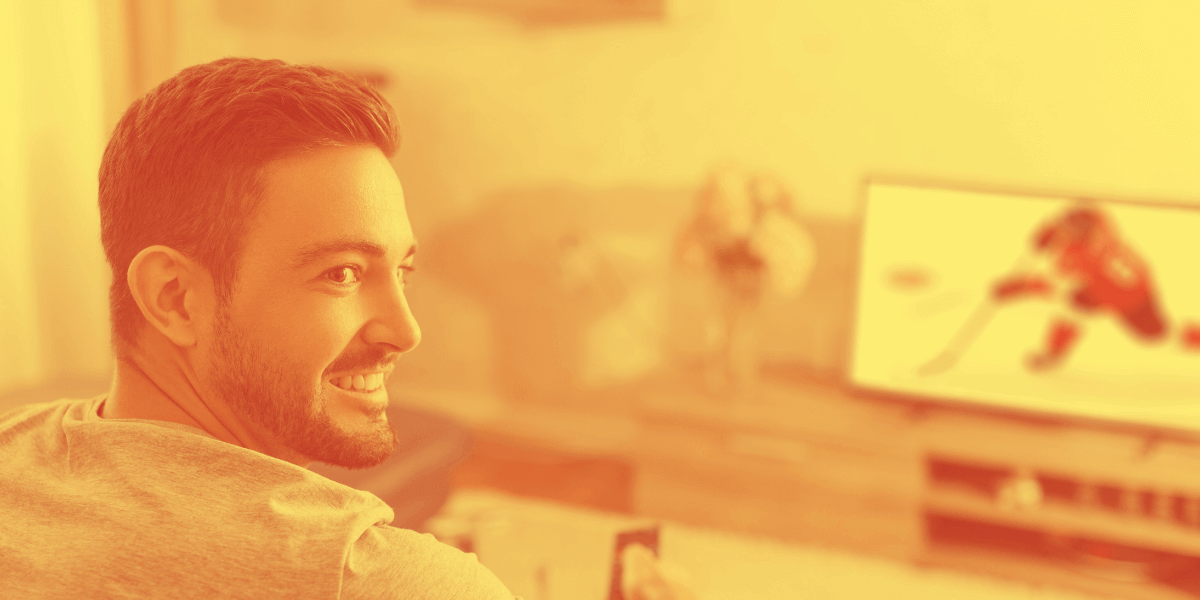 Guy smiling with TV on