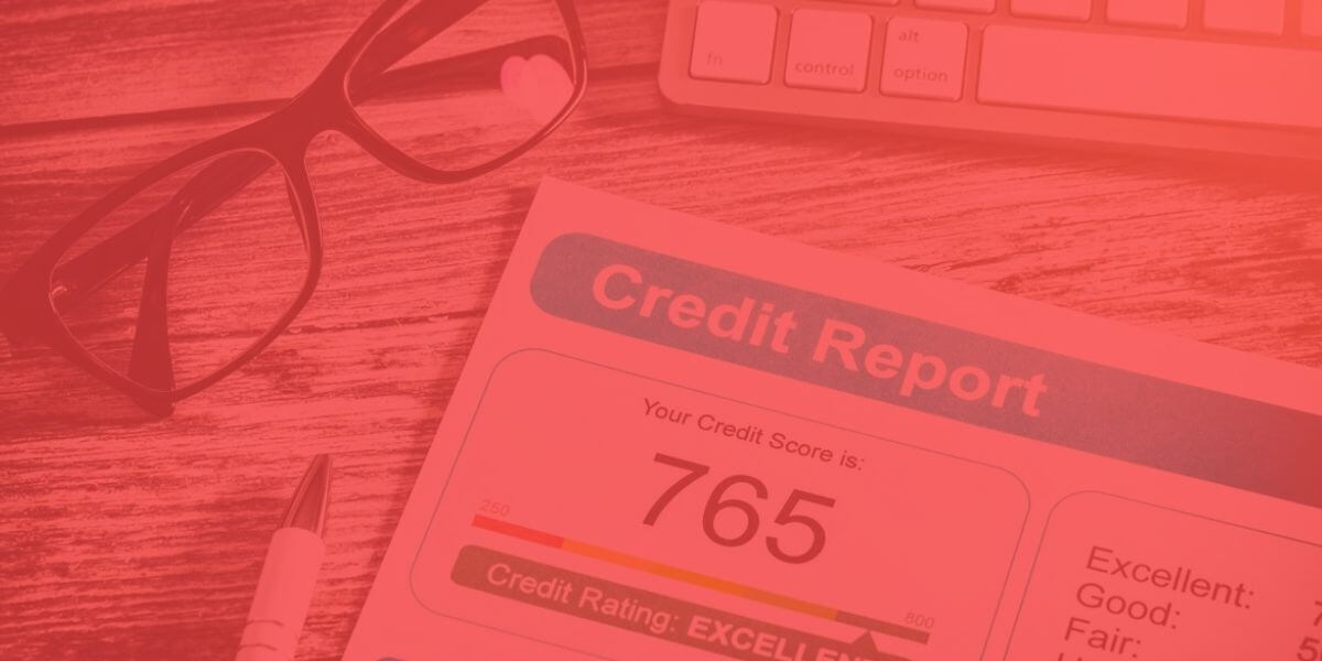 image of credit report lying on desk with pair of glasses