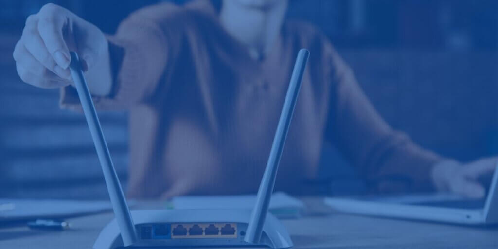 a new router sitting on a desk with a woman behind it