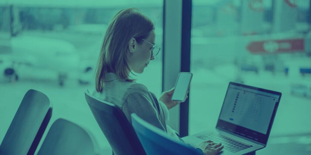 a woman looks bored waiting for her slow airport Wi-Fi