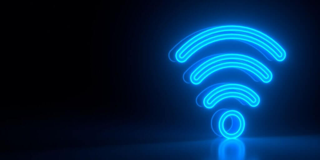 glowing symbol for Wi-Fi against black background