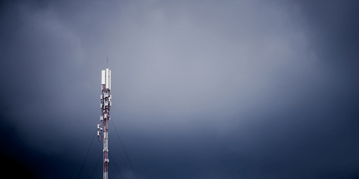 cell tower standing against a stormy sky