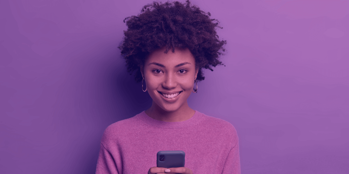 a young girl with a smart phone smiling