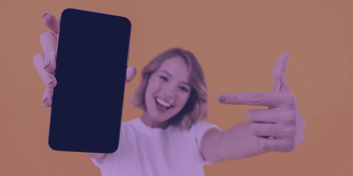 young woman pointing at a smartphone