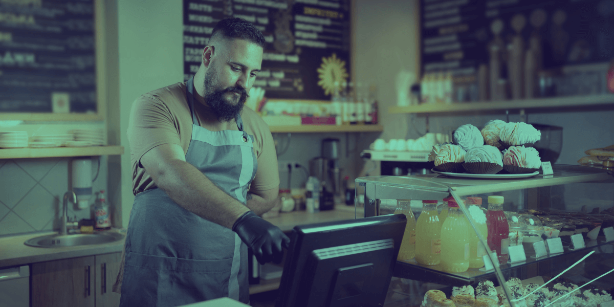 Cafe owner using POS technology