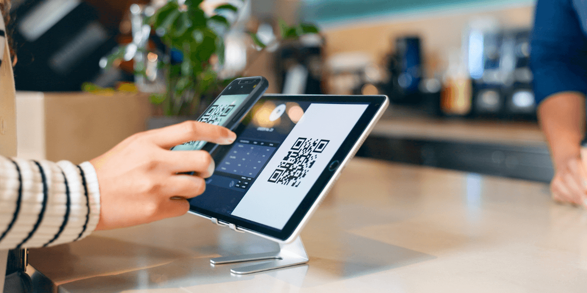 Someone scanning a QR code to pay at a store