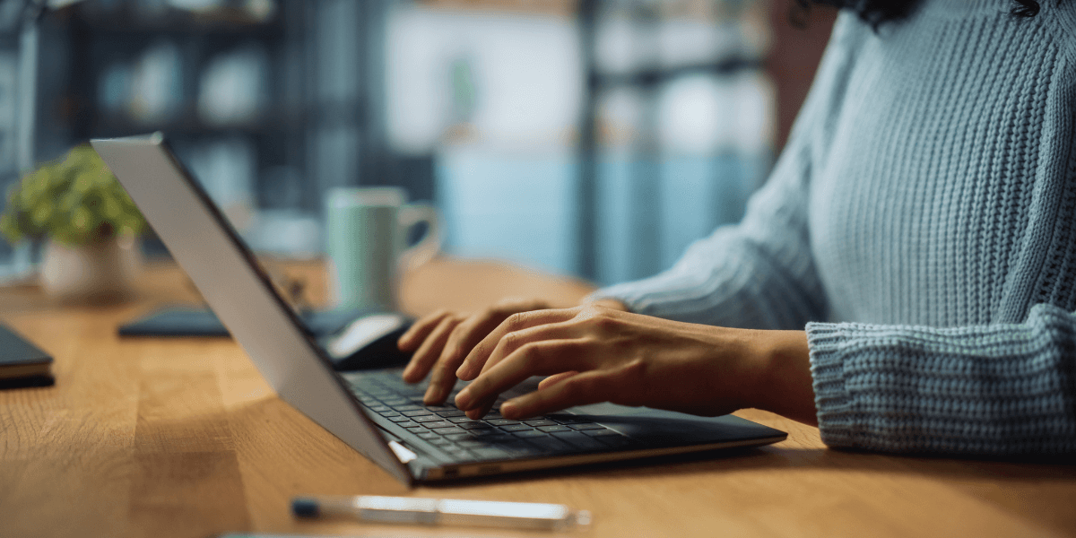 person typing on computer