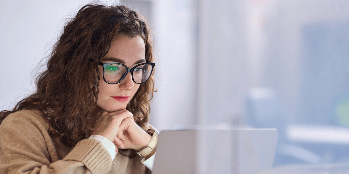 woman looking at her laptop