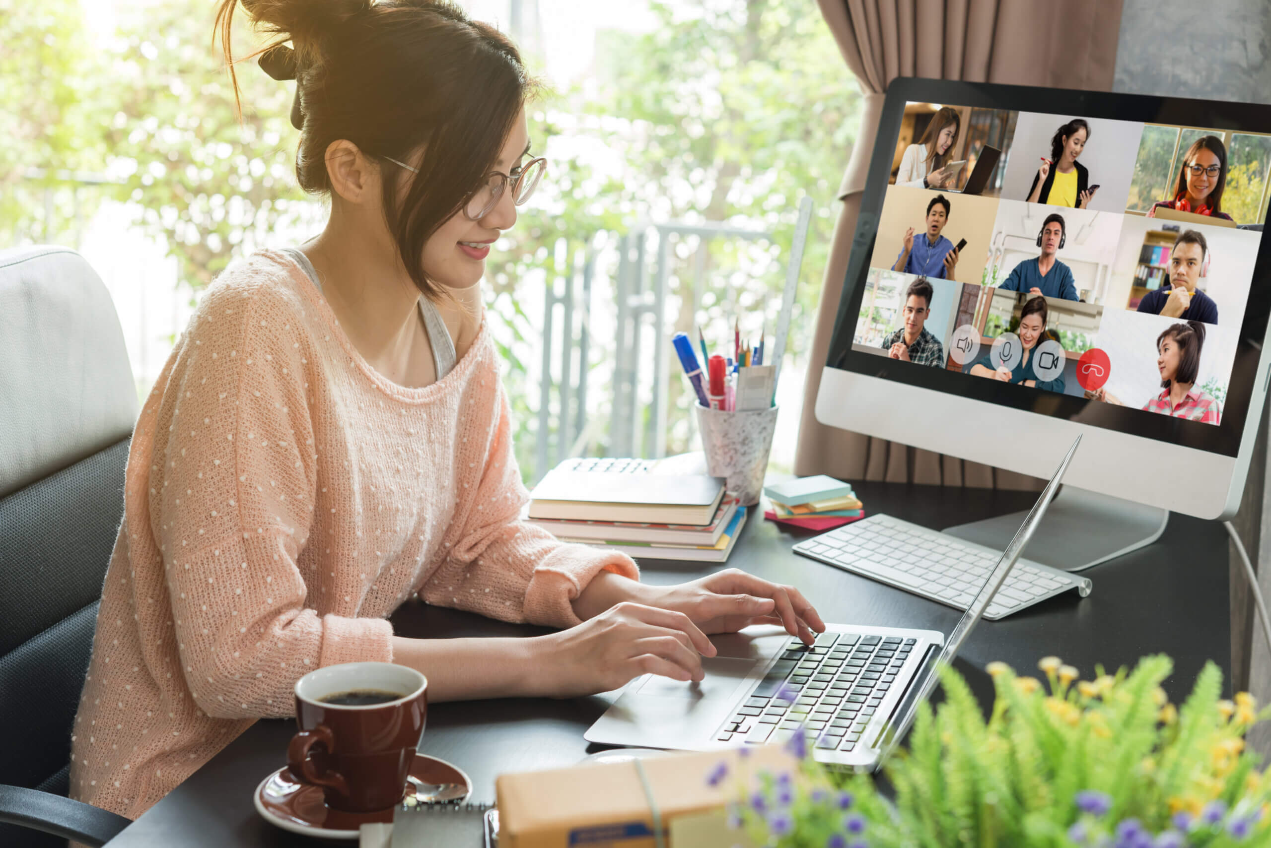 PON vs. AON woman work from home using laptop for teleconference with her teammates