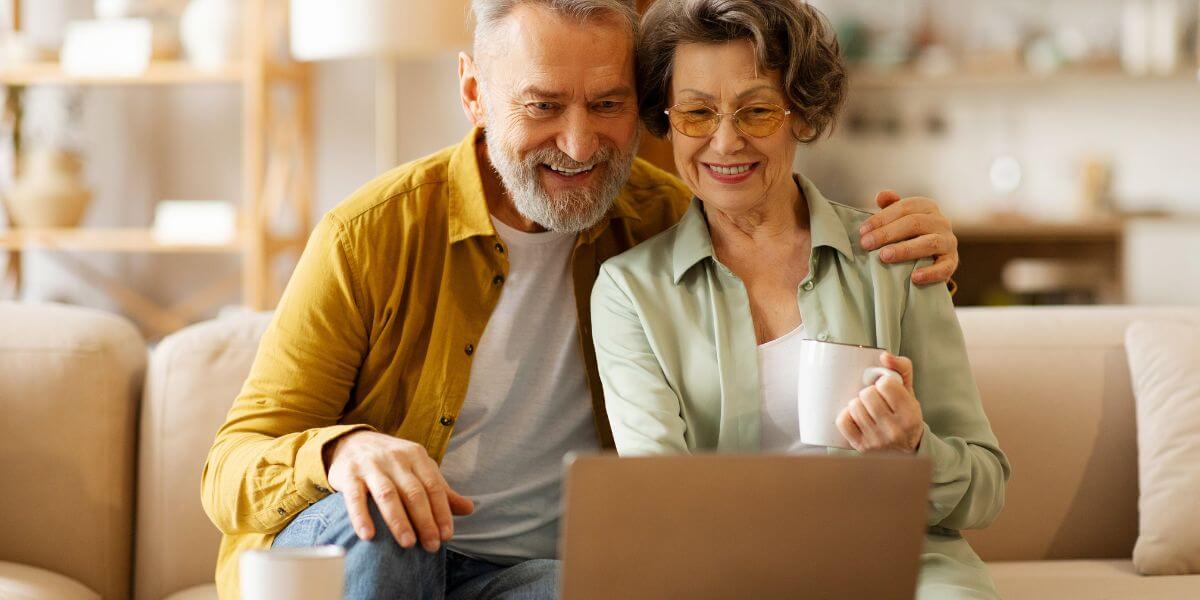 Broadband Equity, Access, and Deployment Program explainer -elderly couple using laptop