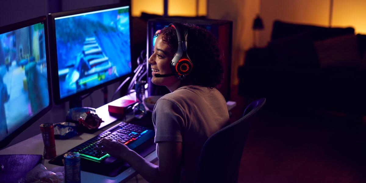 woman playing video games at desk