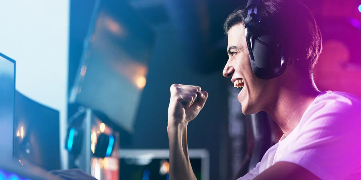 man playing video game at desk