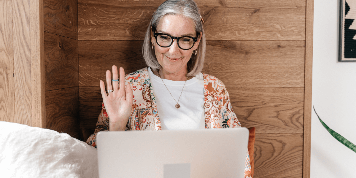 older woman using laptop for video call