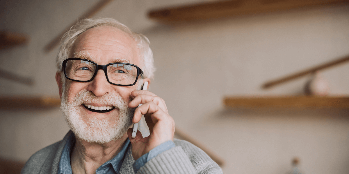 Older gentleman using his cell phone to make a call