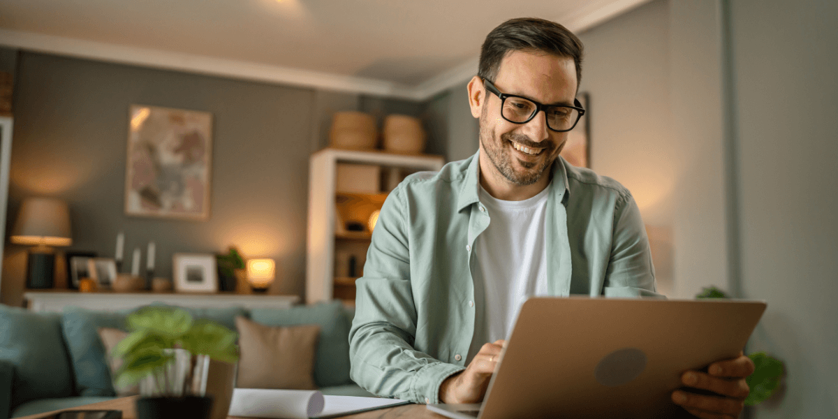 man smiling using computer