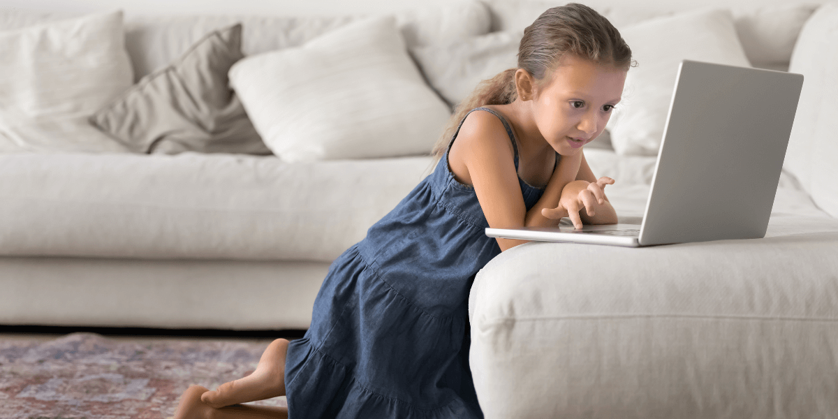 Little girl using a laptop