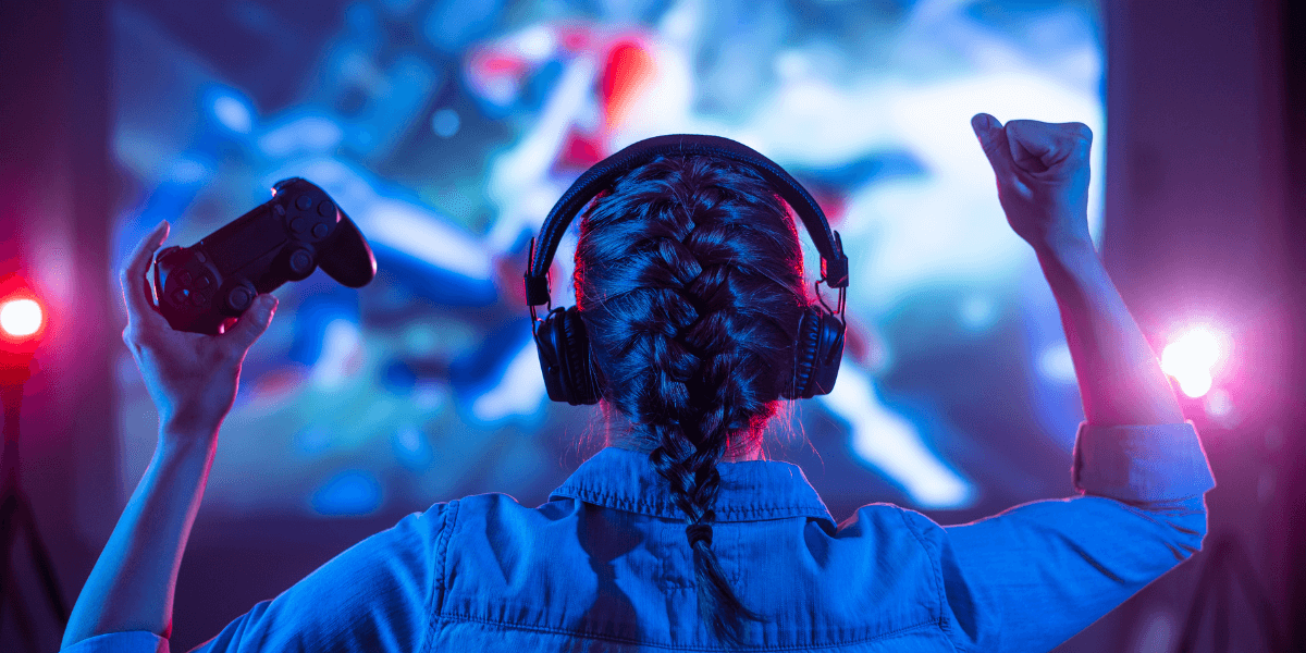 young girl gaming with headphones on