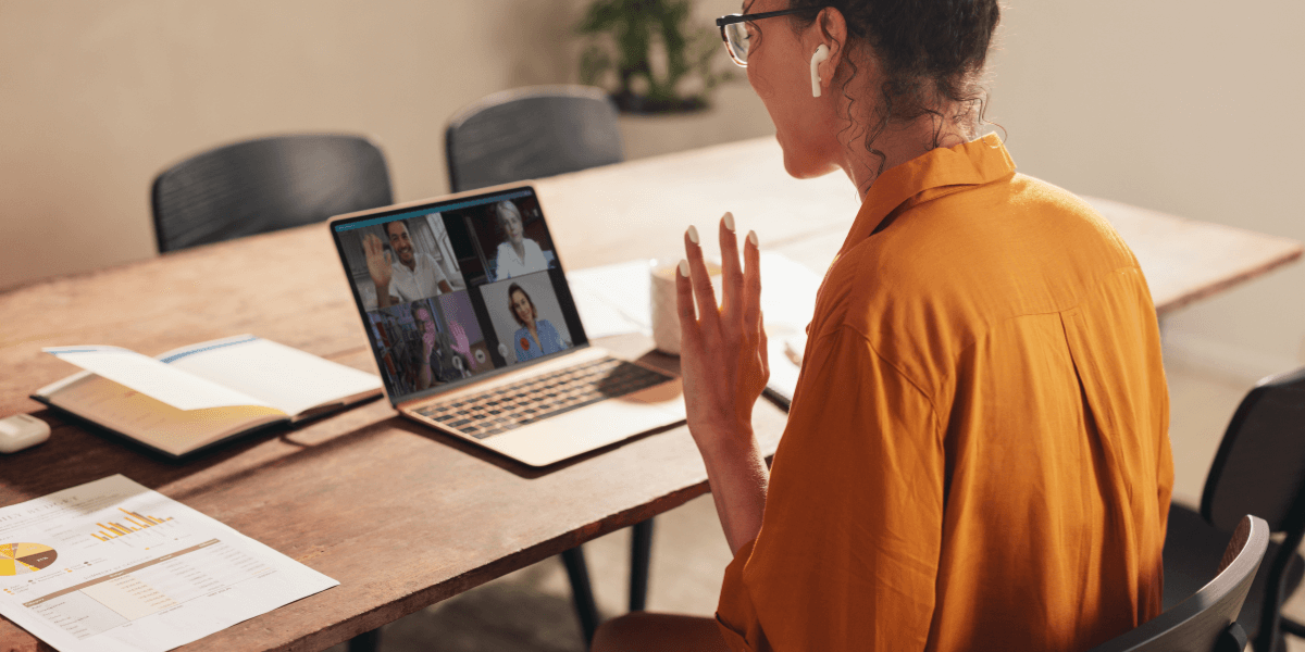 young woman using laptop to video call for work