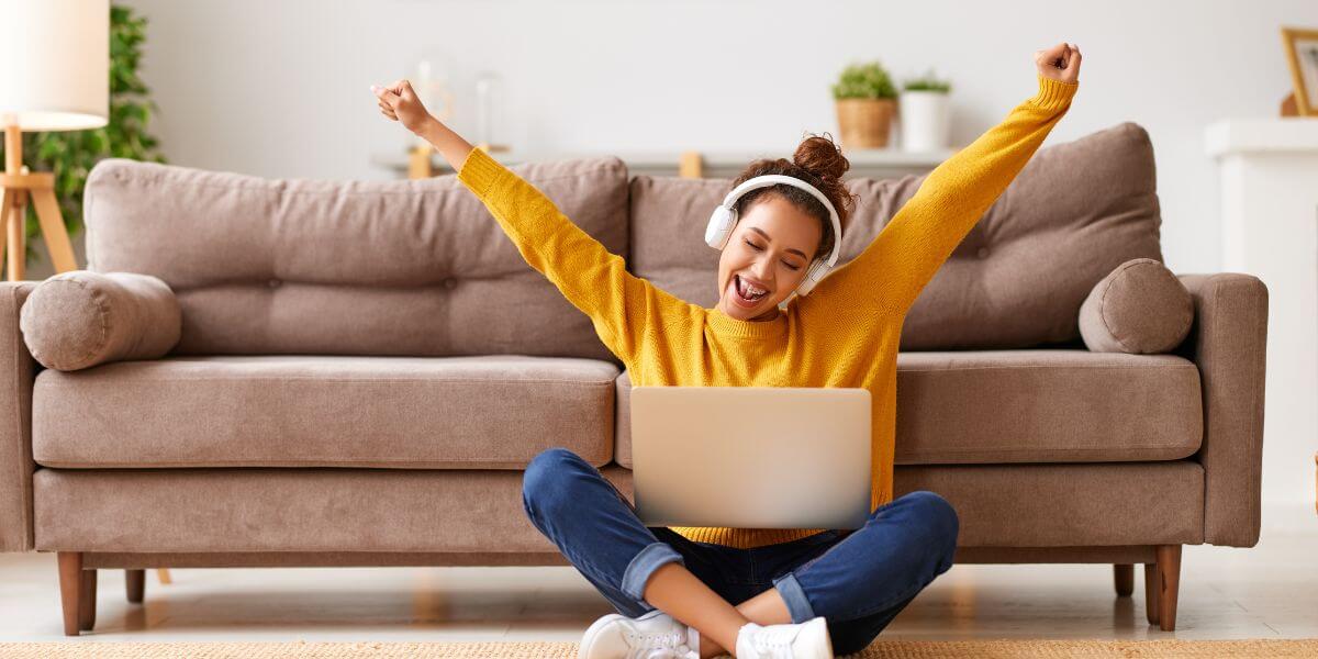 happy woman using laptop