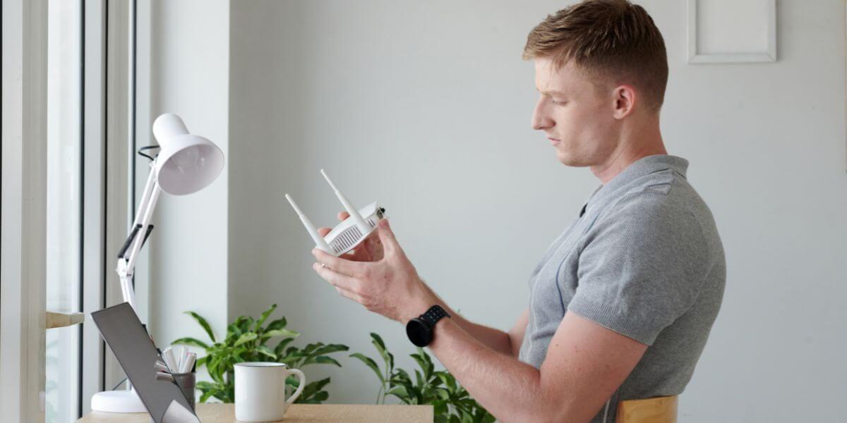 man holding router