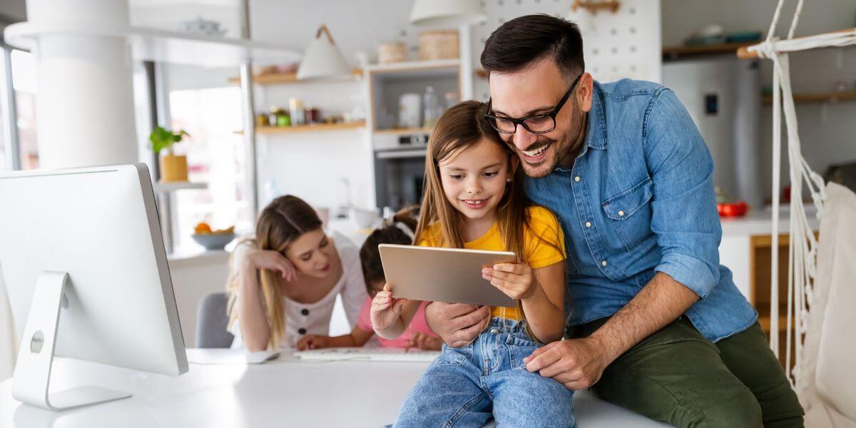 family using laptops and tablets