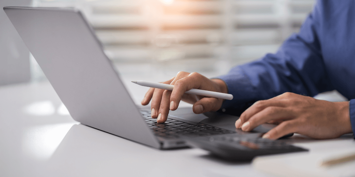 person typing on laptop