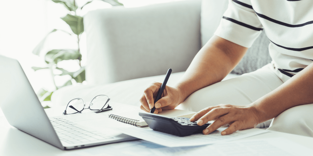 person using computer to calculate taxes