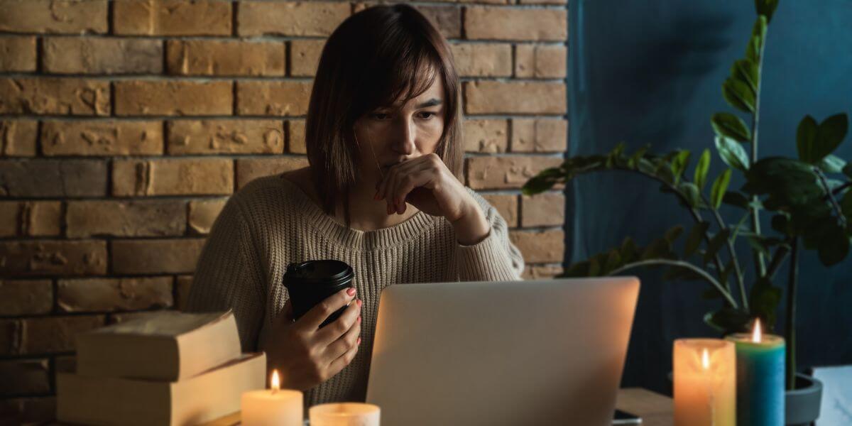 woman looking at computer in power outage