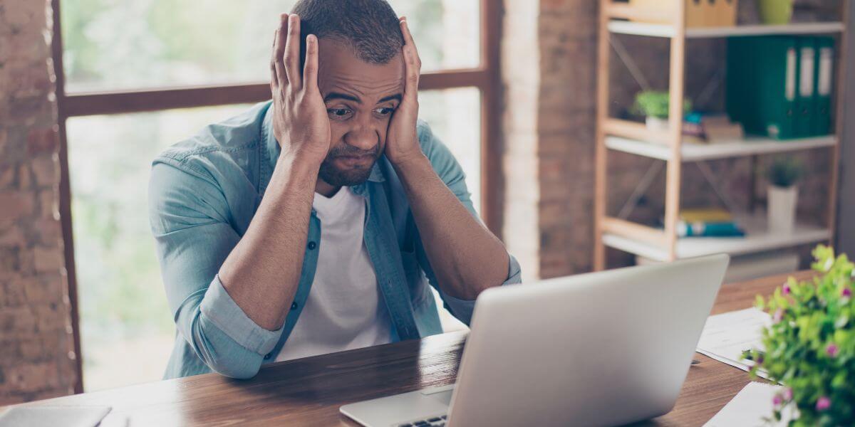 frustrated man with laptop