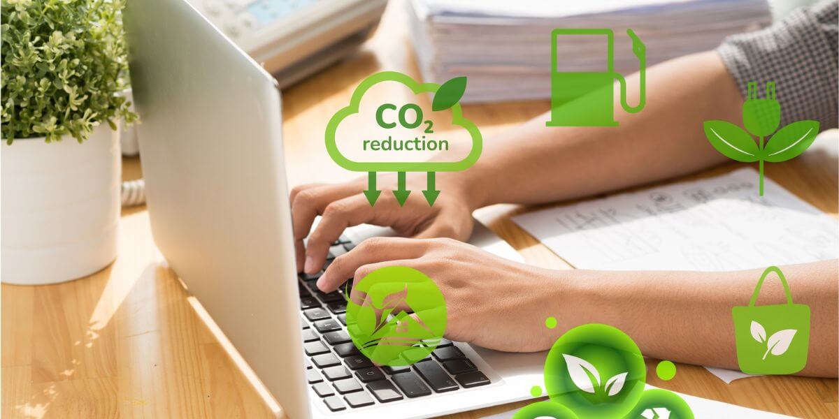 hands at keyboard with eco-friendly icons