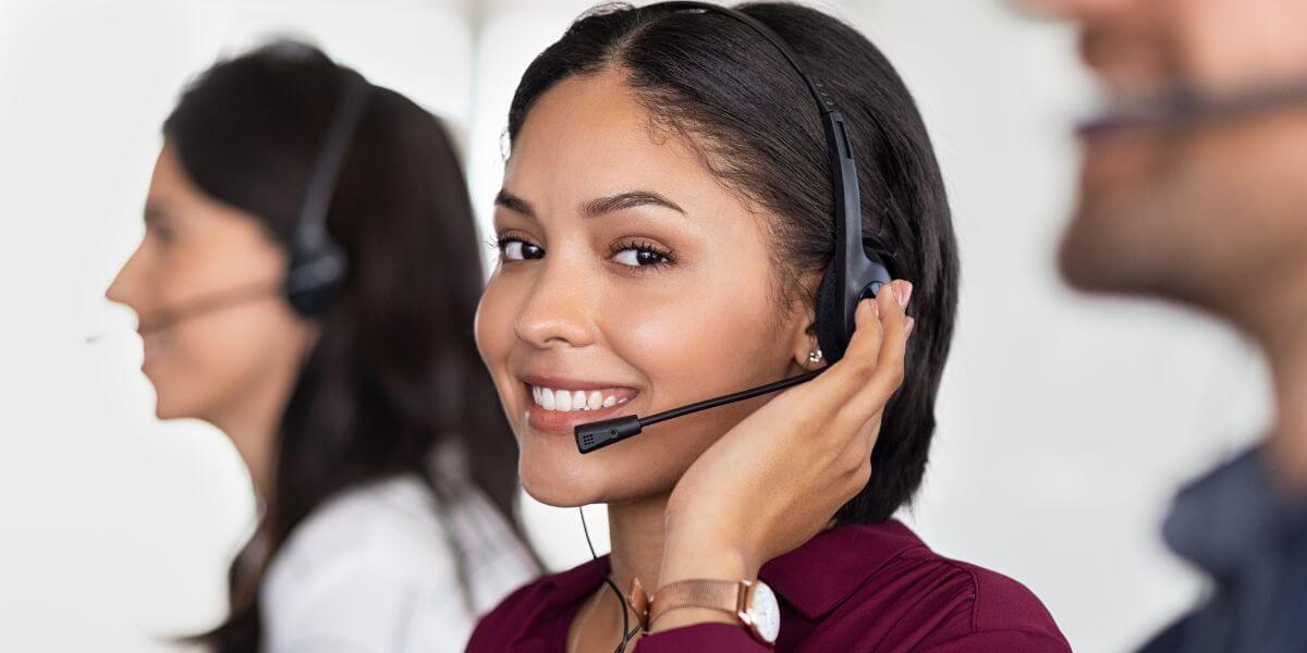 customer service representative touching headset